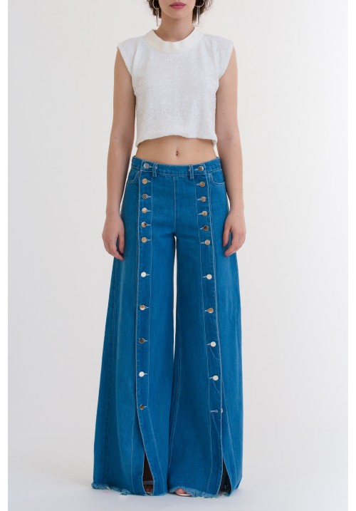 Blue denim flared pants with frontal metallic buttons Blue denim flared pants with frontal metallic buttons