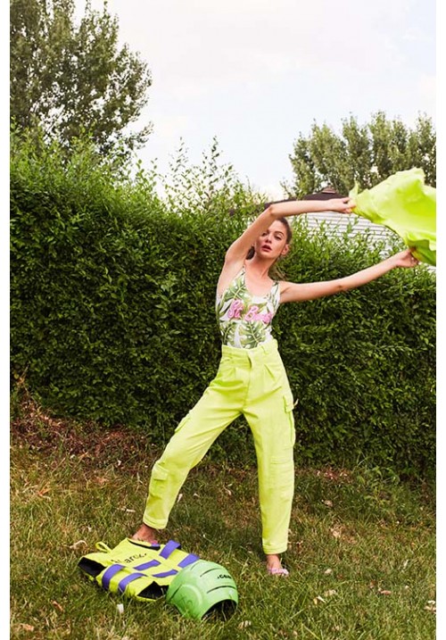 The denim pant with pockets dyed in neon green The denim pant with pockets dyed in neon green